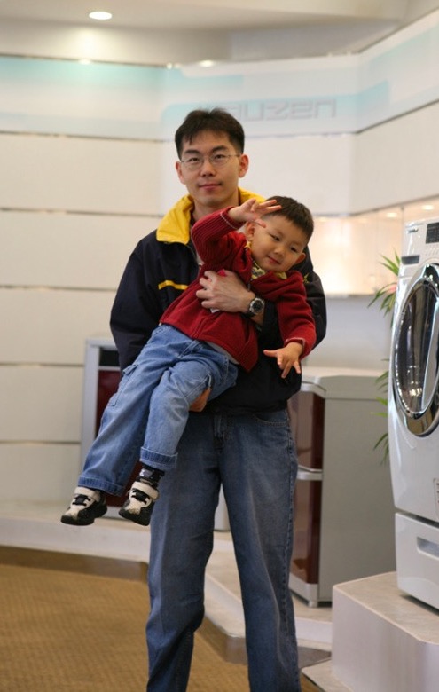 Dad lifting me up in his arms